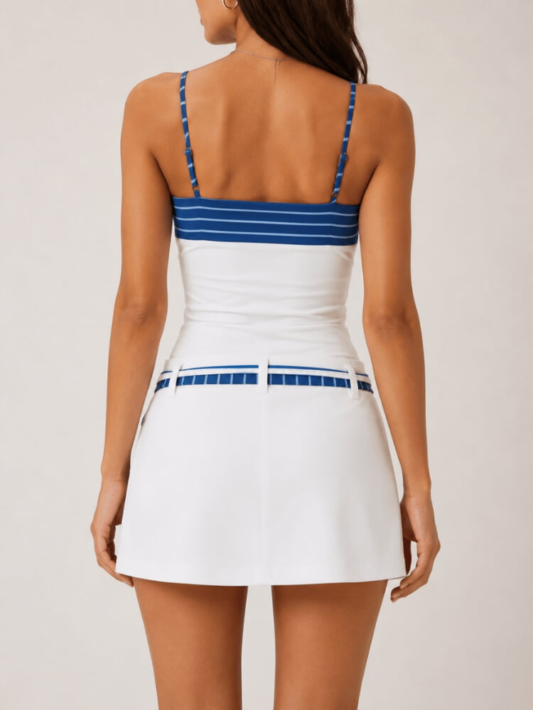 Back view of a coastal-inspired two-piece outfit featuring a halter-style top and white skort.