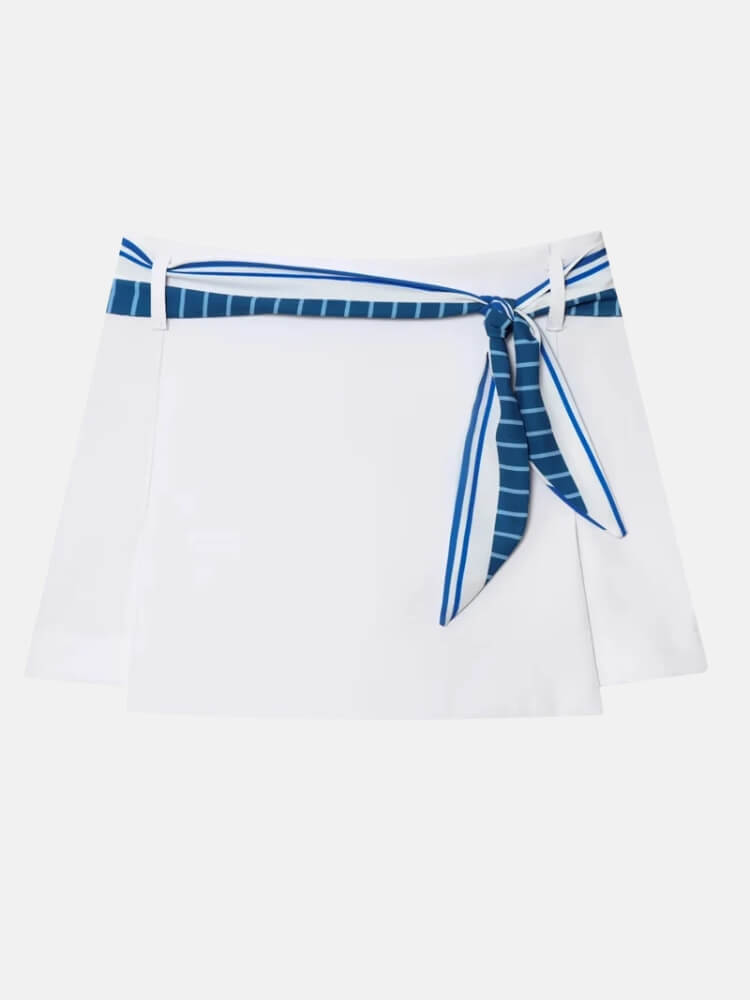Women's coastal chic two-piece outfit featuring a striped top and a stylish white mini skort.